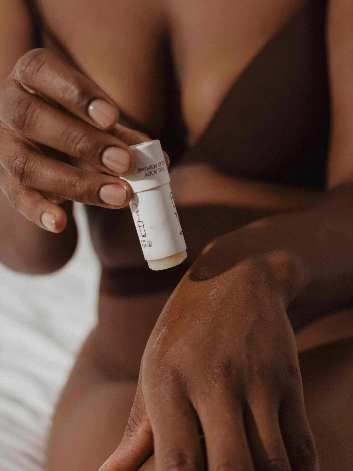 Bijoux Indiscrets intimate solid perfume stick formulated with almond oil, shea butter, and candelilla wax.