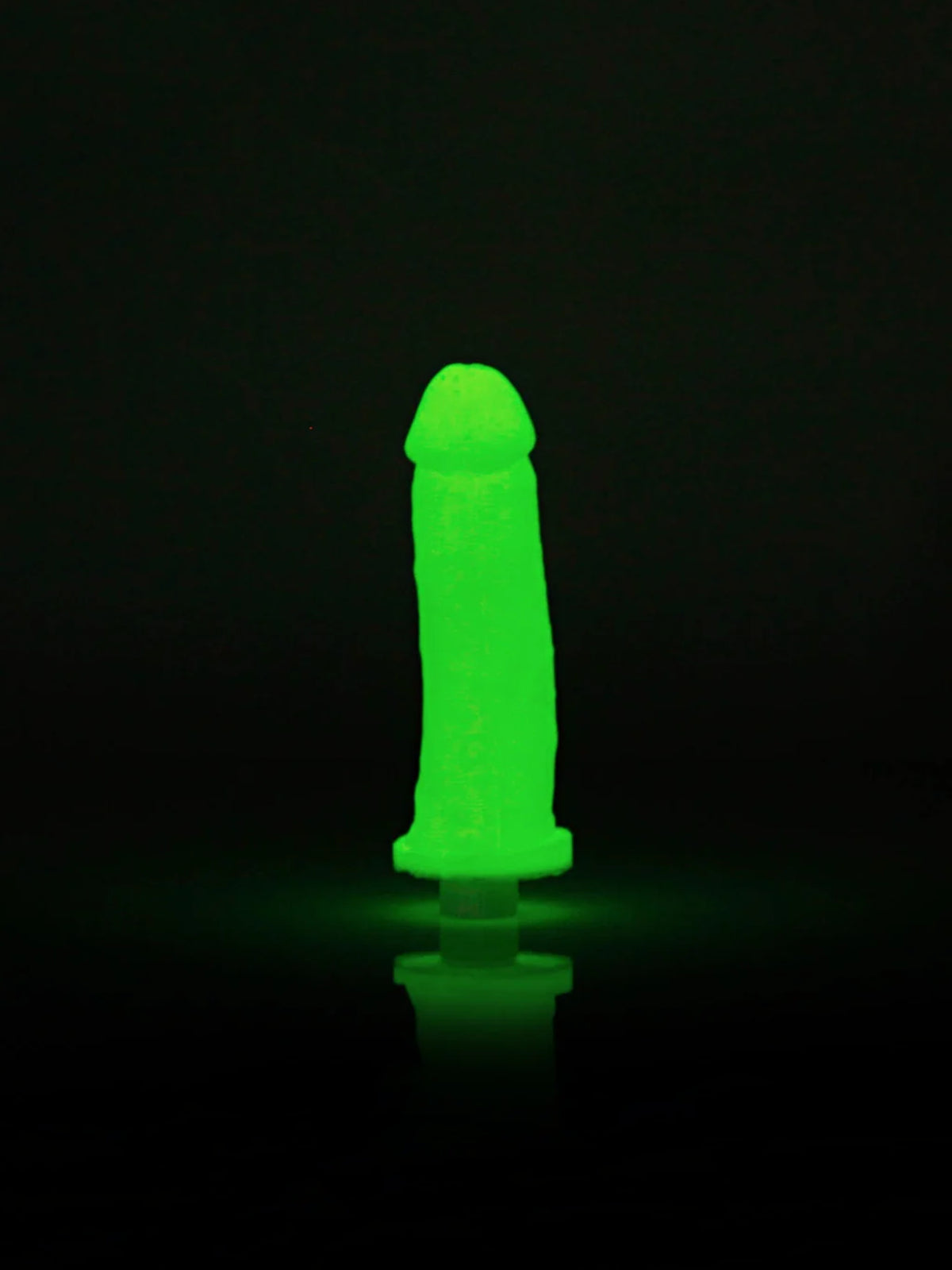 The Clone-A-Willy Glow In The Dark DIY casting kit elements, highlighting the specialized pink glow silicone and integrated single-speed vibrator.