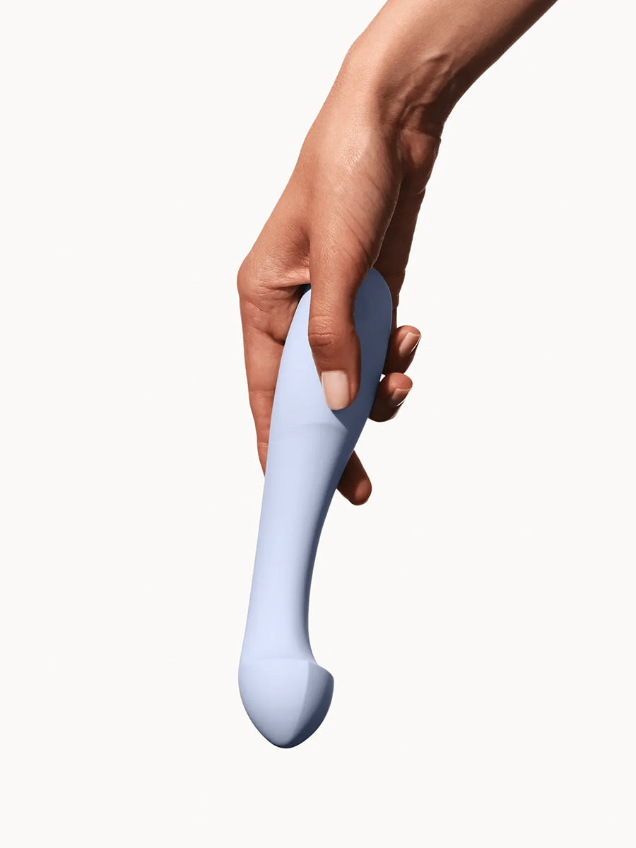Dame Arc ergonomic internal G-spot vibrator with a squishy bulb and curved handle.
