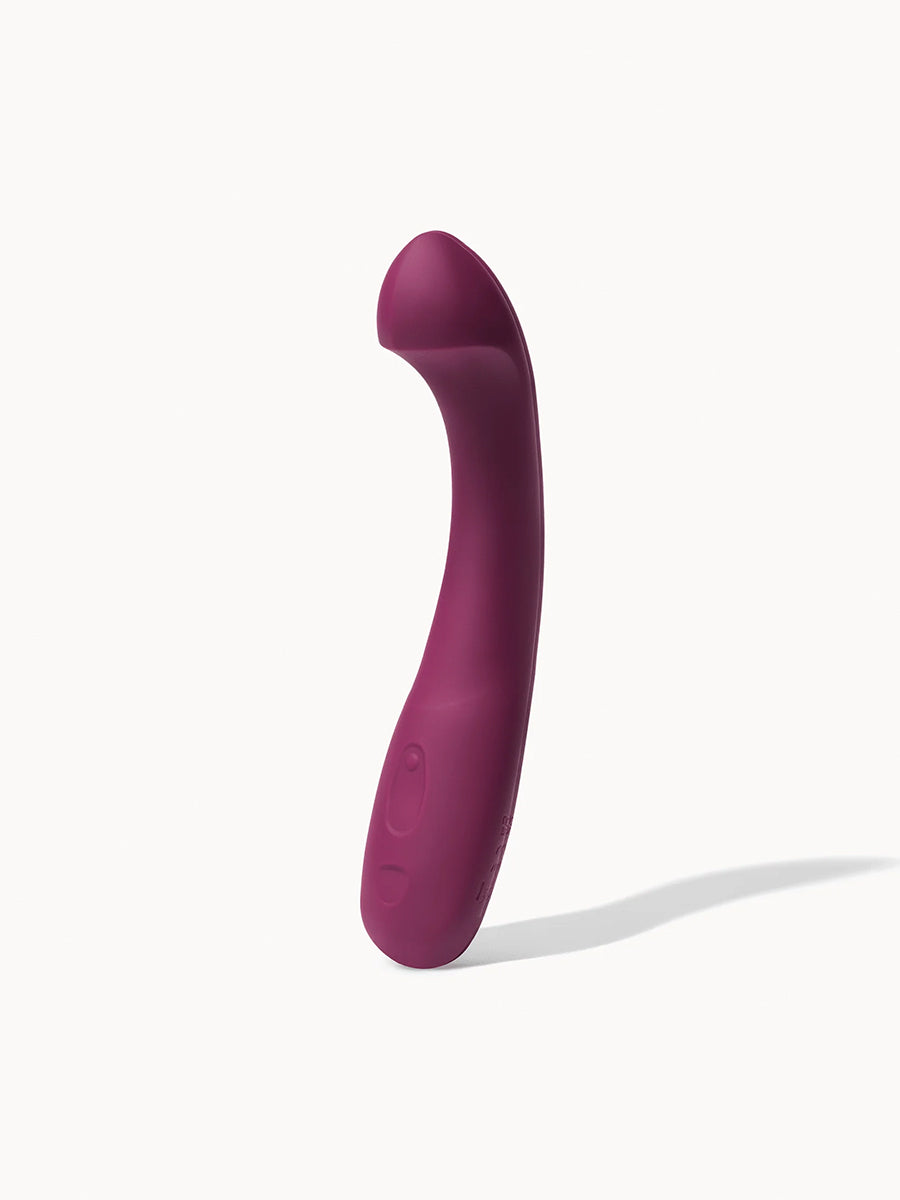 Dame Arc ergonomic internal G-spot vibrator with a squishy bulb and curved handle.