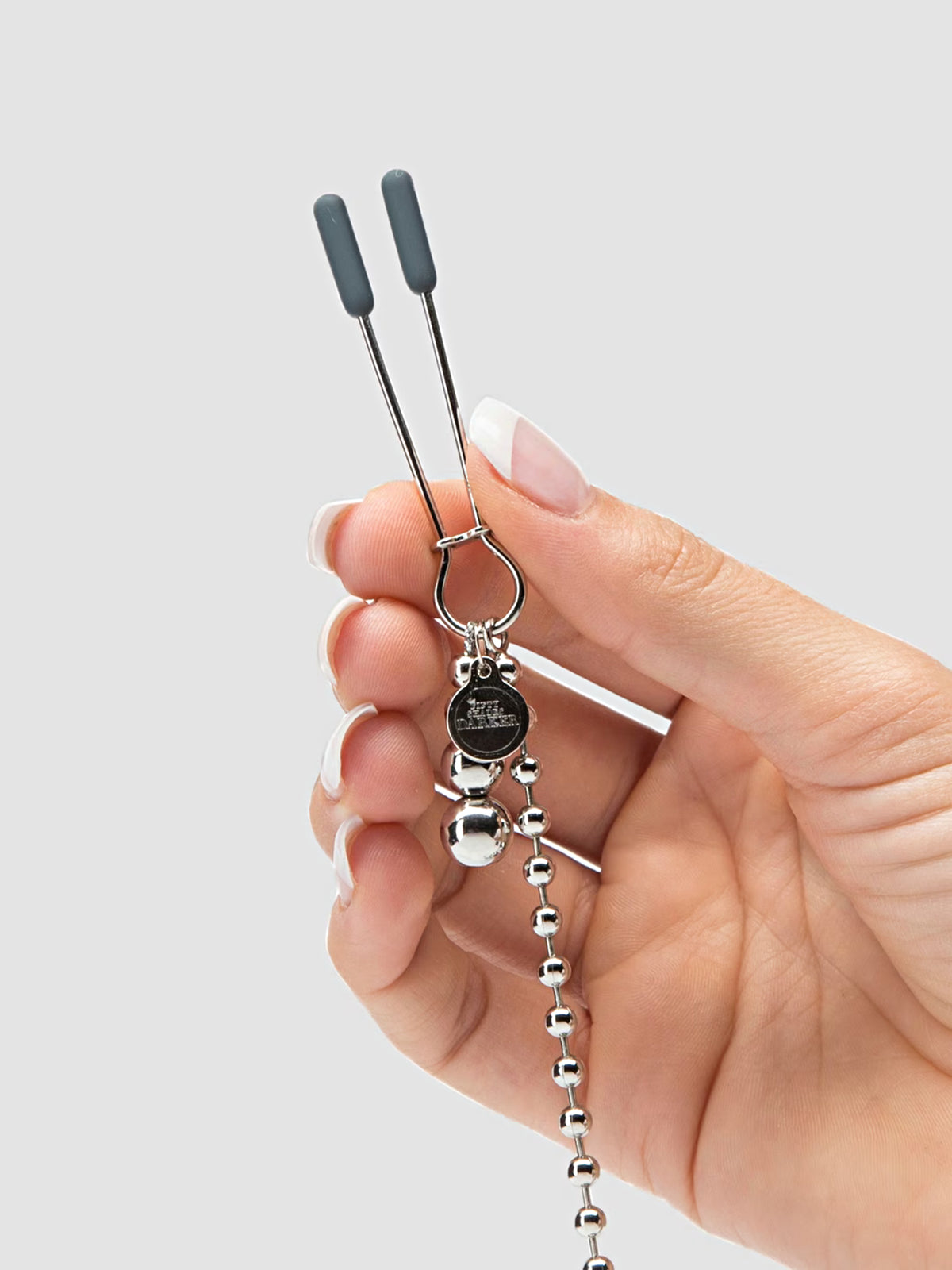 Fifty Shades Darker At My Mercy tweezer-style nipple clamps featuring weighted beaded chains and silicone-covered tips.