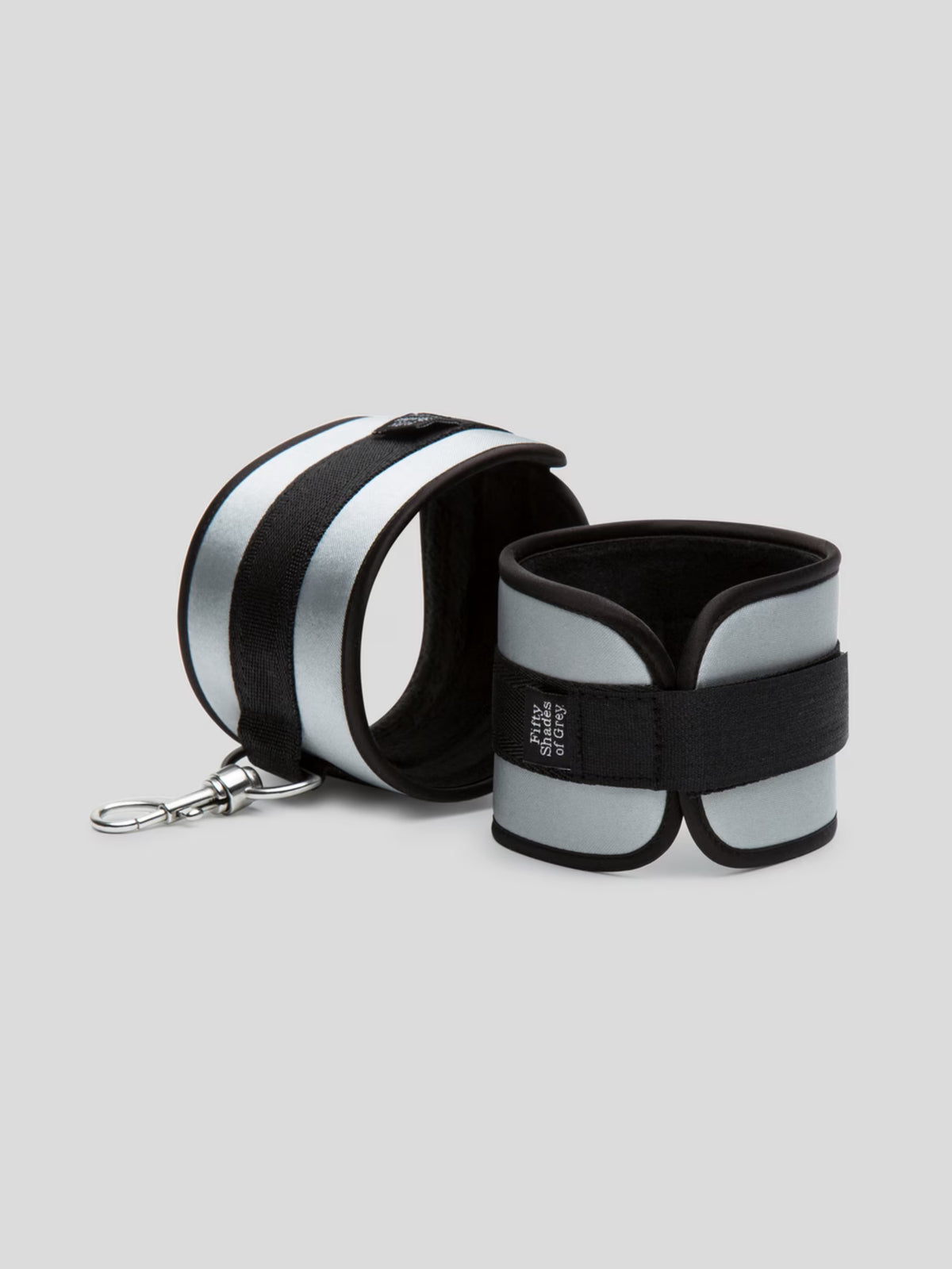 Fifty Shades of Grey Hard Limits 4-piece restraint kit featuring soft satin cuffs, adjustable straps, and a sensory blindfold.