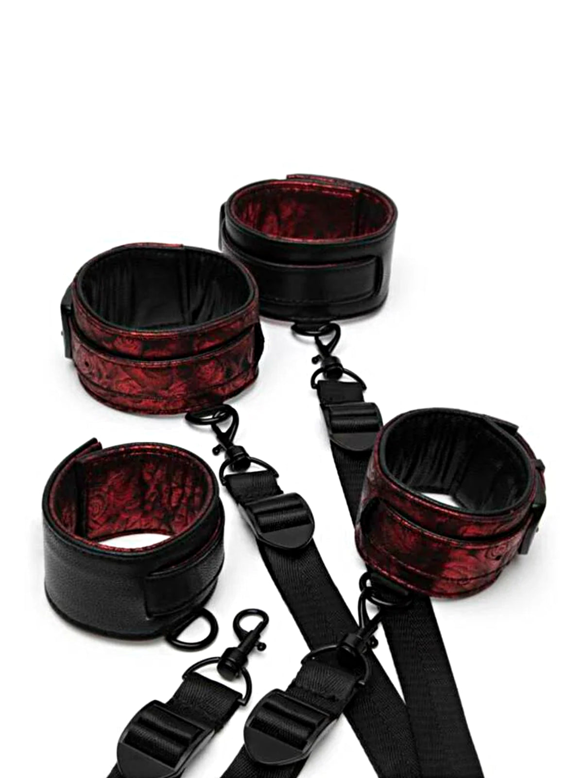 Fifty Shades of Grey Sweet Anticipation reversible under-mattress restraint set featuring padded faux leather cuffs and nickel-free hardware.