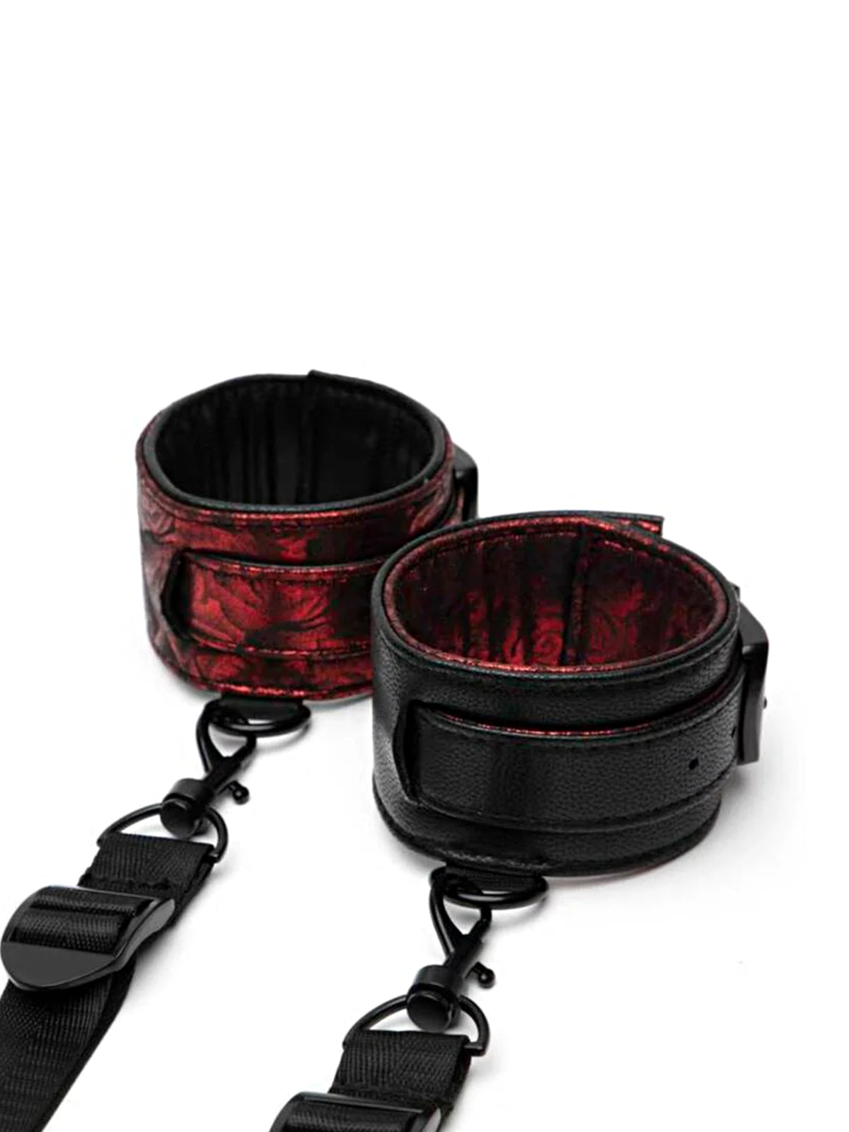 Fifty Shades of Grey Sweet Anticipation reversible under-mattress restraint set featuring padded faux leather cuffs and nickel-free hardware.