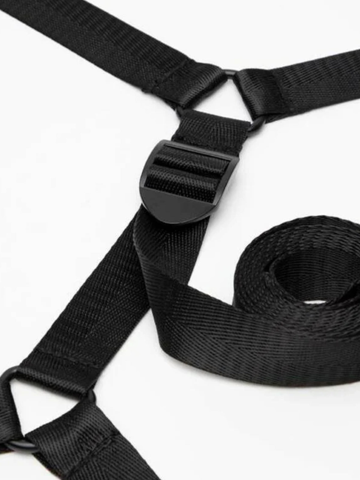 Fifty Shades of Grey Sweet Anticipation reversible under-mattress restraint set featuring padded faux leather cuffs and nickel-free hardware.