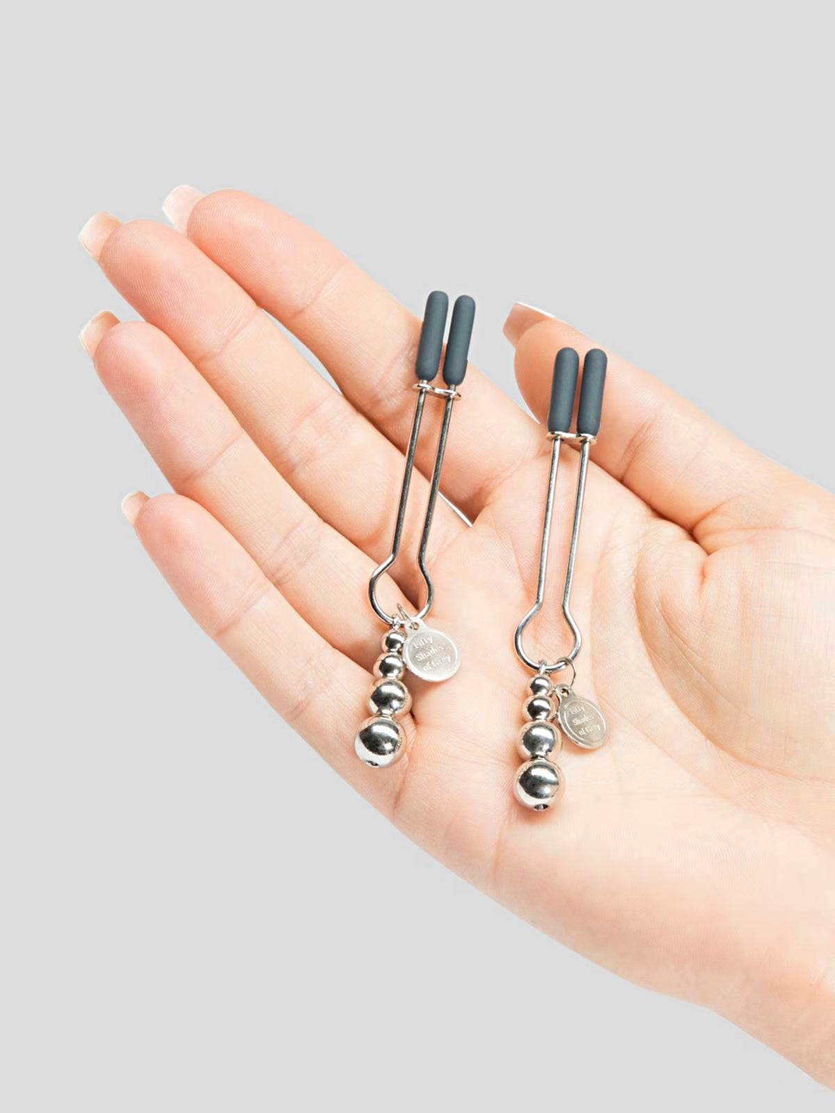 Fifty Shades of Grey The Pinch adjustable nipple clamps featuring calibrated screws and broad rubber tips for tailored tension.